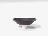 Dame Lucie Rie, A Footed Bowl, circa 1975, fine sgraffito banding to the exterior and interior, white glazed foot with white glazing to well