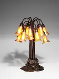 Twelve-Light Lily Lamp by Tiffany Studios, patinated bronze, Favrile glass, bronze stamped 'TIFFANY STUDIOS NEW YORK 382',, sold Dec 2018