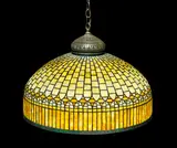 Curtain Border Shade by Tiffany Studios, mounted as a chandelier, leaded glass, patinated bronze, sold Jun 2018
