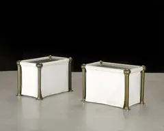 John Dickinson, Two Custom End Tables, stainless steel, brass, and vinyl-trimmed canvas