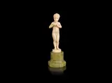 Ferdinand Preiss, a Carved Ivory Study of a Boy Clasping an Apple