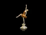 Louis Sosson, a Carved Ivory and Gilded Bronze Study of a Female Dancer, circa 1925, raised off a marble base