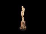 Joé Descomps, an Art Deco Carved Ivory Study of a Naked Female Clasping Floral Blooms, circa 1925, raised off a variegated marble base