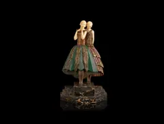 Lucille Sévin, 'Whispers' an Art Deco Patinated and Carved Ivory Group, circa 1925, raised off a stepped and variegated marble base