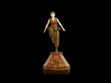 'Oriental Dancer' an Art Deco Patinated Bronze and Carved Ivory Figure by Demetre Chiparus, circa 1925, raised off an elaborate marble and onyx base, offered Jun 2018