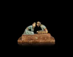 'Tender Promises' an Art Deco Patinated Bronze and Carved Ivory Group by Demetre Chiparus, circa 1925, modelled as a costumed pair of young lovers in tender confrontation, they kneel on a variegated stepped marble base, sold Jun 2018
