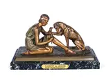'Accident de Chasse' an Art Deco Gilded and Cold-Painted Bronze Study by Demetre Chiparus, circa 1925, raised off a variegated marble base, sold Jun 2018