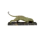 an Art Deco Textured and Patinated Model of a Prowling Panther by Demetre Chiparus, circa 1925, on large variegated marble base, sold Jun 2018