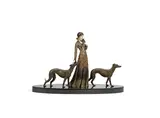 'Friends' an Art Deco Patinated Metal and Ivorine Study by Demetre Chiparus, circa 1925, raised on oval marble base, sold Jun 2018
