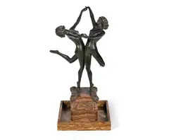 Cl.J.R Colinet, 'Country Dance' an Art Deco Patinated Bronze Study of Two Naked Female Dancers circa 1925, raised off an elaborate variegated marble tray base inset with bronze figural plaques and adorned with corner mounts