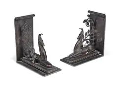 a Pair of Art Deco Wrought Iron Bookends with Seated Gazelles Amid Foliage by Edgar Brandt, circa 1925, a Pair of Art Deco Wrought Iron Bookends with Seated Gazelles Amid Foliage, circa 1925, offered Jun 2018
