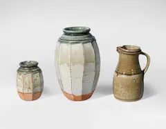 Two Vases and a Jug by Richard Batterham, circa 1985, stoneware, in pale green glazes, the large and small vase of the same cut-sided design, offered Jun 2018