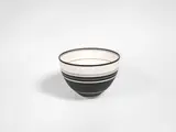 Nicholas Homoky, A Banded Bowl, circa 1994, porcelain, inlaid and painted with slip, creating monochrome bands in varying width