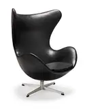 Arne Jacobsen, An Egg chair, designed 1958, this example manufactured in 1965 by Fritz Hansen, Fibre-glass shell, black vinyl upholstery, steel revolving base, bearing manufacturer's labels to the stem