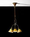 Three-Light Hanging Fixture by Tiffany Studios, patinated bronze with decorated Favrile glass shades, armature stamped 'Tiffany Studios New York 606', sold Dec 2017