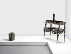 Gio Ponti, and Piero Fornasetti, A desk designed c.1950 decorated with the 'Coromandel' pattern introduced in the 1960's, Lithographed wood, mahogany, bakelite and brass, with maker's disc to one drawer 'Fornasetti Milano'