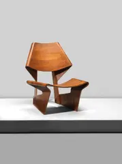 Grete Jalk, A rare Shell chair, designed 1963 and manufactured by Poul Jeppensen, Denmark, Laminated plywood with teak veneer, PJ monogramed maker's stamp and Furniture Makers Danish Control stamp to the underside