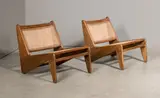 Pair of Kangourou fireside chairs, circa 1955 by Pierre Jeanneret, rattan, offered Jun 2016