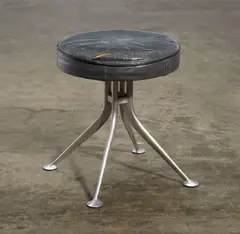 Stool by Alexander Girard, aluminum, leather upholstery, manufacturer's circular enameled metal label to underside, sold Apr 2015