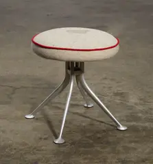 Stool by Alexander Girard, aluminum, upholstery, manufacturer's circular enameled metal label to underside, sold Apr 2015