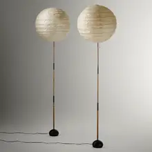 Akari light sculptures model 19D on single stem bases, pair by Isamu Noguchi, washi paper, bamboo, enameled cast iron, sold Mar 2023