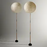 Akari light sculptures model 19D on single stem bases, pair by Isamu Noguchi, washi paper, bamboo, enameled cast iron, sold Mar 2023
