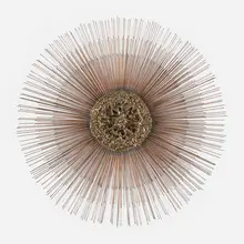 Sunburst wall sculpture by C. Jeré, c. 1980, brass and copper-plated steel, sold Feb 2023