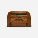 Radio, model A309 by Charles and Ray Eames, c. 1946, combed oak, plastic, Bakelite, brass, silk, sold Feb 2023