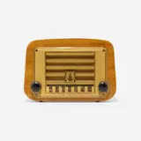 Radio, model 578A by Charles and Ray Eames, 1946, mahogany plywood, plastic, Bakelite, sold Feb 2023
