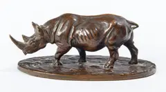 Rhinoceros by Jack Meltcalf, 1931, Patinated bronze statue signed and dated on oval base, sold Apr 2022