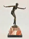 Dimitri Haralamb Chiparus, Female Dancer with Arms Outstretched, Stepped rouge-de-fer marble