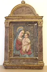 A Follower Of Antonio Rossellino, The Madonna and Child, Late 17th century or later polychromed and gilded stucco relief based on the original 1460s marble relief on display at the Hermitage Museum and attributed to the Florentine sculptor Antonio Rossellino