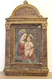 The Madonna and Child by A Follower Of Antonio Rossellino, Late 17th century or later polychromed and gilded stucco relief based on the original 1460s marble relief on display at , sold Nov 2022