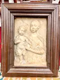 Madonna and Child, 18th century or later chiseled marble high relief after the work of early Italian artists such as Gregorio Di Lorenzo by Master of the Marble Madonnas, Marble relief is within an 18th century continental patinated picture frame, sold Nov 2022
