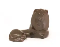 Claude Lhoste, Untitled, a cast bronze modelled as a recumbent lion