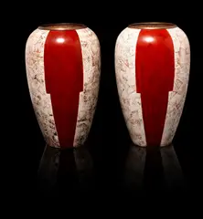 Jean Dunand, A Pair of Vases, circa 1925, of ovoid form, lacquered metal, inlaid with eggshell, in a panelled geometric design