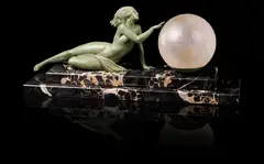 Fayral (pseudonym, for Pierre Le Faguays), circa 1925, cast as a naked maiden reclining on stepped marble base with light fitment and large globular glass shade