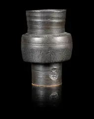 A Small Footed Pot by Hans Coper, circa 1958, stoneware, of cylindrical form, sold Jun 2014