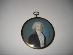 Arnoud, A Gentleman, wearing black coat with brown collar, white figured waistcoat, frilled chemise, stock and tied cravat, his hair powdered.