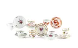 Sieben Tassen und Untertassen mit Blumen-, Insekten- und Drachendekor by Meissen, Porzellan, farbig staffiert, sold Jan 2025