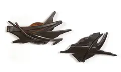 Two  paperweights by Albert Paley, 1994, patinated wrought-iron, offered Dec 2012