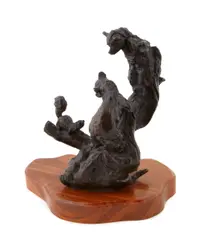 Gary Joseph Schildt, Two bear cubs playing with a squirrel, bronze with brown patina on a wooden base