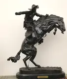 Frederic S. Remington, Bronco Buster, Presented on a granite base. - Bronze: 22.25 inches; height with base: 23.75 inches