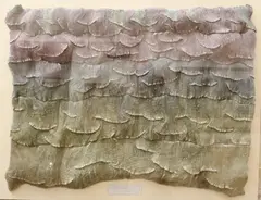 Ardyth Gray Trimmer Davis, Wave Sequence 2, Pleated fabric sculpture, shaded lavender to muted green. - Acrylic box frame, 31 in. x 39 3/4 in. x 4 5/8 in