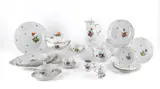 59 Teile aus einem Speiseservice mit Blumendekor und Korbrelief by Nymphenburg, Porzellan, farbig staffiert, gold konturiert, sold Jan 2025