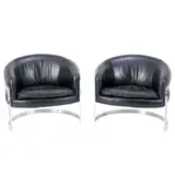 Milo Baughman, PAIR OF LEATHER ARMCHAIRS, Black leather upholstered barrel seats on cantilever chrome bar frames