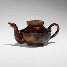 Teapot by George E. Ohr, 1895-96, glazed earthenware, sold May 2025