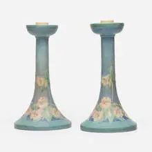 Candleholders with trumpet flowers, pair by Anna Frances Simpson, 1923, glazed earthenware, sold May 2025