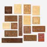 Collection of sixteen carved panels by Evelyn Ackerman, 1964-1976, bas-relief wood, sold Sep 2022