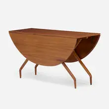 Spider drop-leaf dining table by Greta Magnusson Grossman, c. 1952, walnut, sold Sep 2022